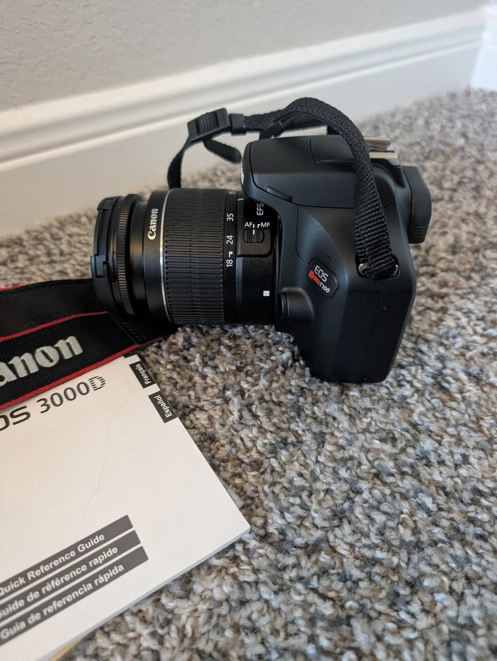 Canon Black DSLR Camera with Lens and Strap